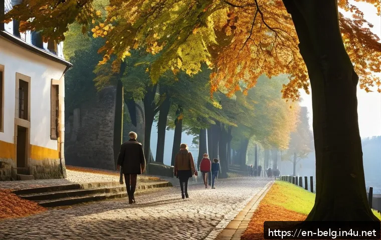 벨기에 왈롱 지역 - A peaceful medieval town in Wallonia during early autumn, featuring narrow cobblestone streets lined...